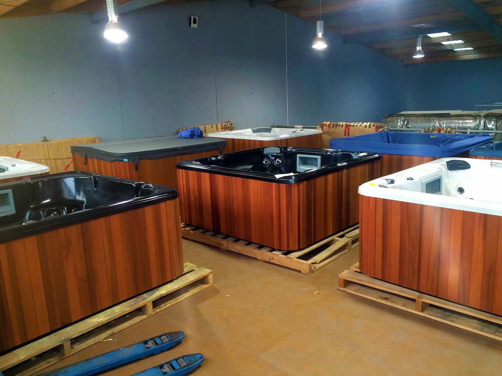 A view of our factory's spa pool setup with a wide variety of spas.